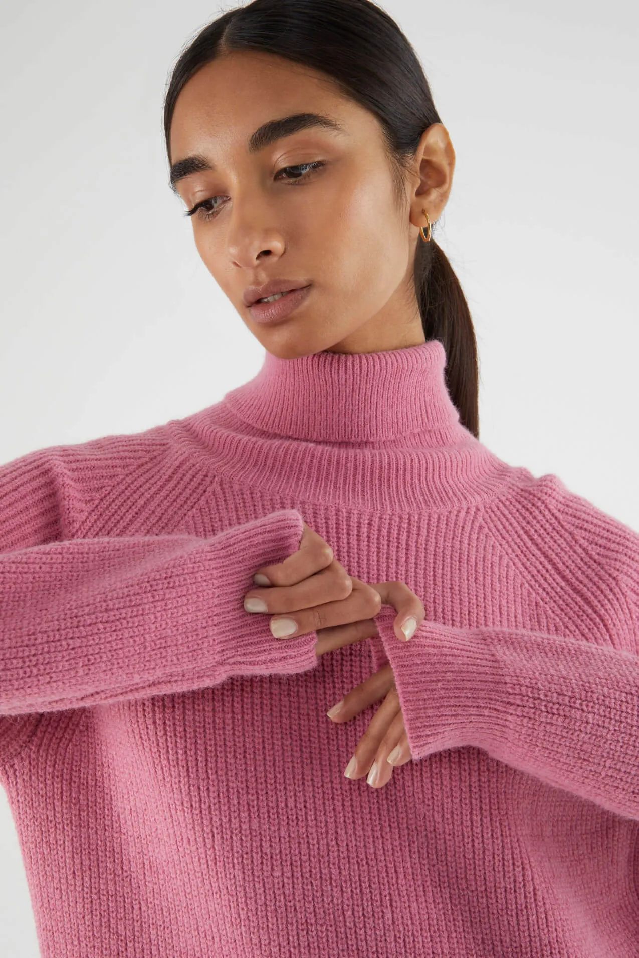 Pink turtleneck midi knit dress by Compania Fantastica