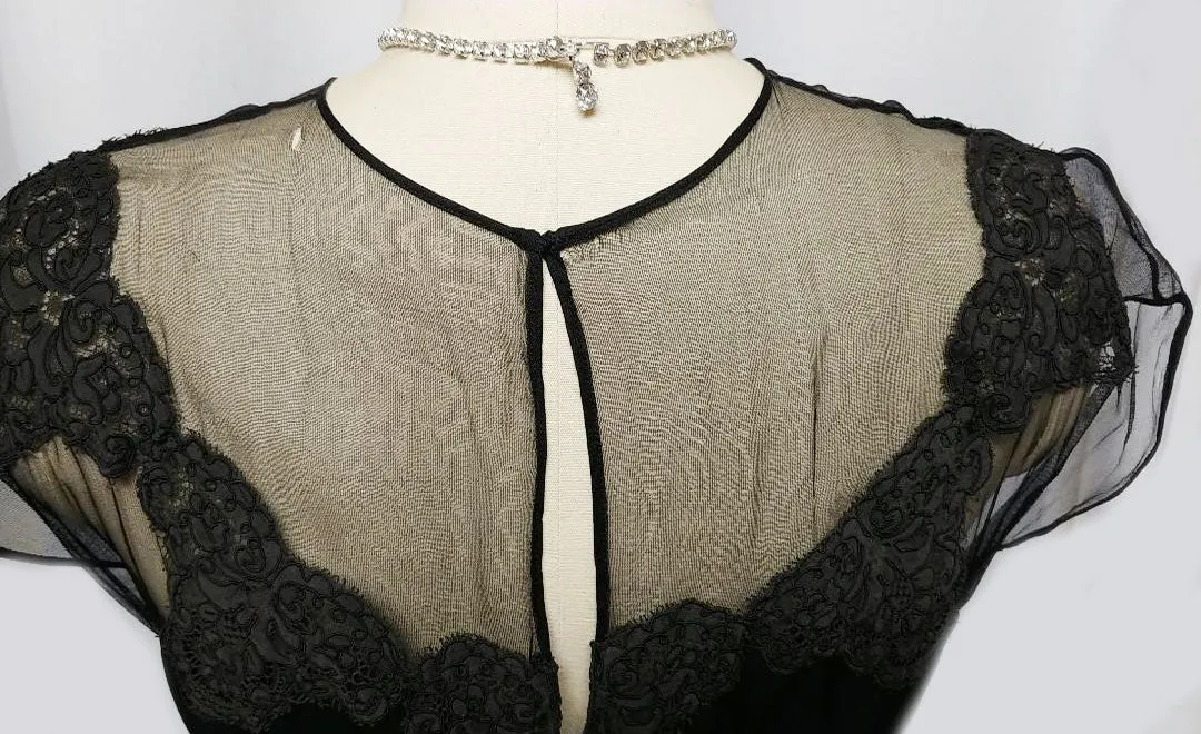 *VINTAGE "70S BLACK ILLUSION JEAN OF CALIFORNIA COCKTAIL DRESS ADORNED WITH CHANTILLY LACE